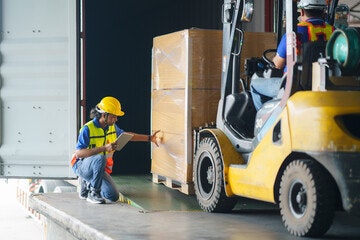 Man looking at box on machine